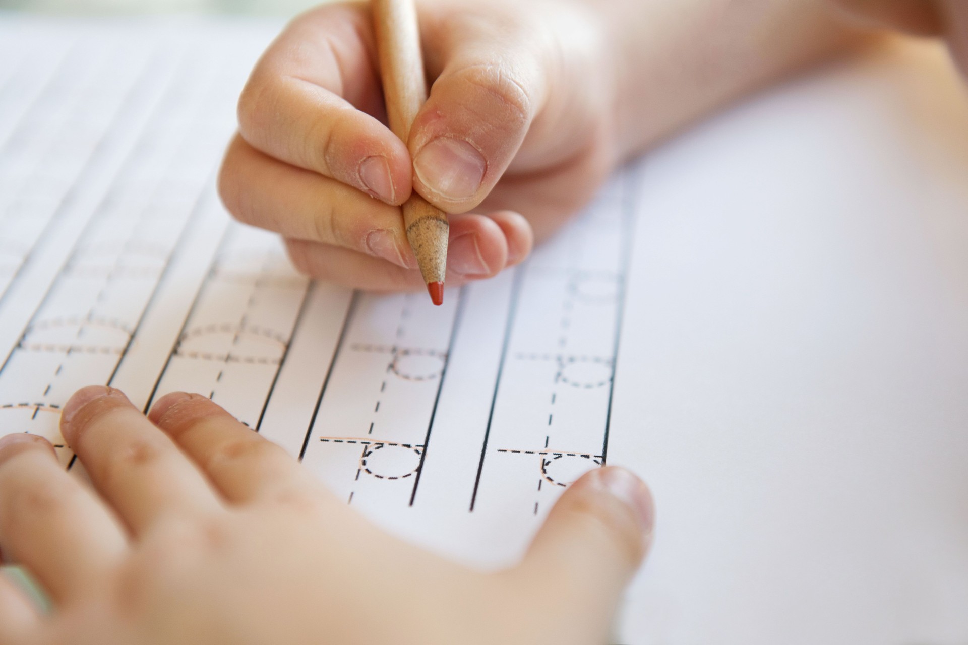Close-up  pencil in the hand of child.